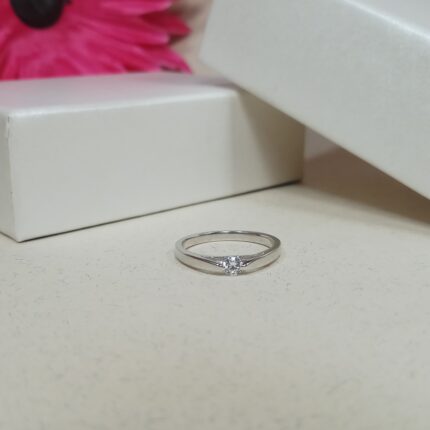 Starlight Embrace: Sterling Silver Solitaire Ring