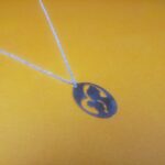 Mother's Embrace: Personalized Motherhood Pendants