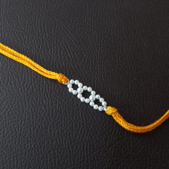 Moti Rakhi: Elegant Pearl Accent in 925 Silver