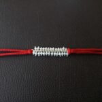 925 Silver Pearl Rakhi: Timeless Beauty