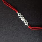 Gleaming Silver Beads Rakhi