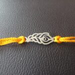 Elegant Plumage: Handcrafted Morpankh Silver Rakhi
