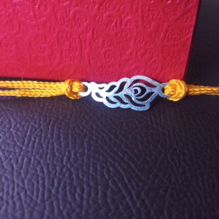 Elegant Plumage: Handcrafted Morpankh Silver Rakhi