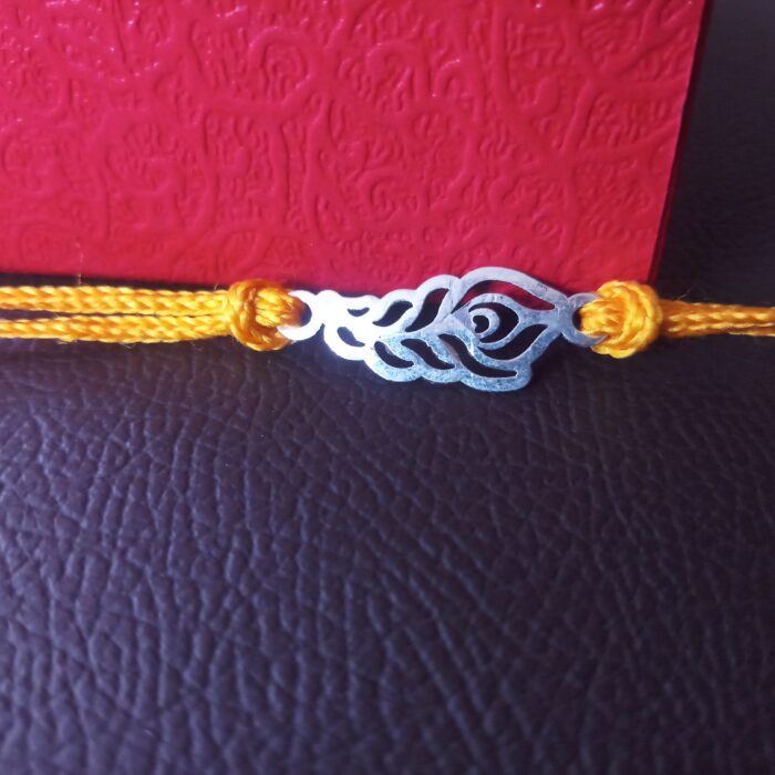 Elegant Plumage: Handcrafted Morpankh Silver Rakhi