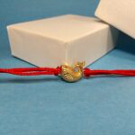 Silver 925 Golden Peacock Rakhi: Graceful Symbol of Sibling Love