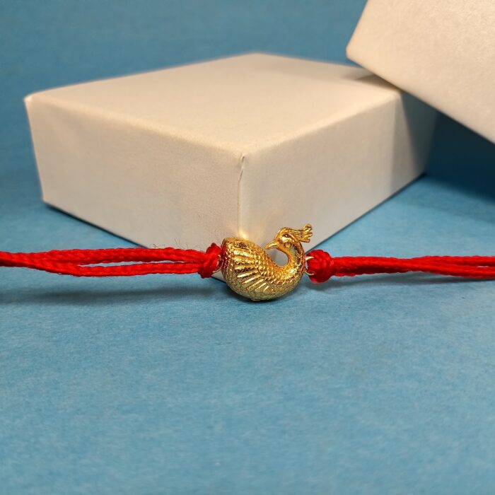 Silver 925 Golden Peacock Rakhi: Graceful Symbol of Sibling Love