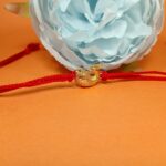 Silver 925 Golden Peacock Rakhi: Graceful Symbol of Sibling Love