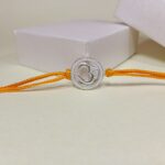 Divine Om Rakhi: Sterling Silver Elegance