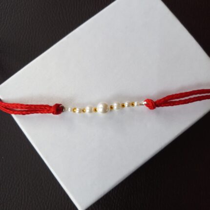 Radiant Pearl Rakhi: Symbolizing Purity and Love