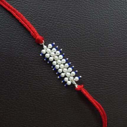 Radiant Pearl Rakhi: Graceful Bond of Siblings