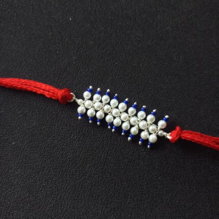 Radiant Pearl Rakhi: Graceful Bond of Siblings