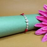 Radiant Pearl Rakhi: Symbolizing Purity and Love