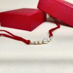 Radiant Pearl Rakhi: Symbolizing Purity and Love