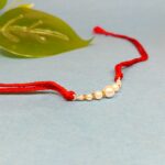 Radiant Pearl Rakhi: Symbolizing Purity and Love