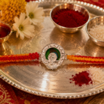 Divine Ganesha Silver Rakhi with Red & Yellow Thread
