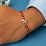 Designer Pure Silver Om Rakhi with Red Stones & Beads