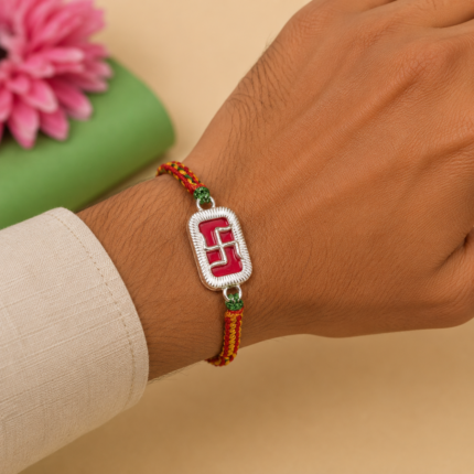 Elegant Pure Silver Swastik Rakhi with Red Enamel & Thread Work