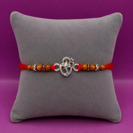 Pure Silver Ganesh Rakhi with Sacred Symbol & Traditional Thread
