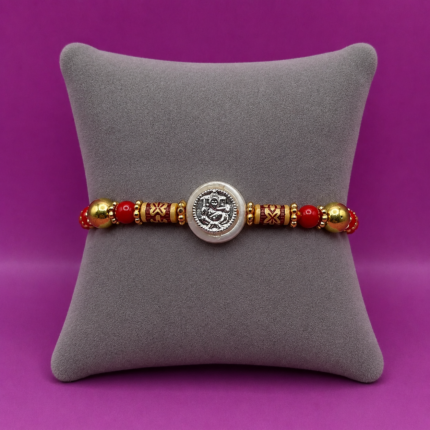 Pure Silver Ganesh Rakhi with Beads Red & Yellow Thread