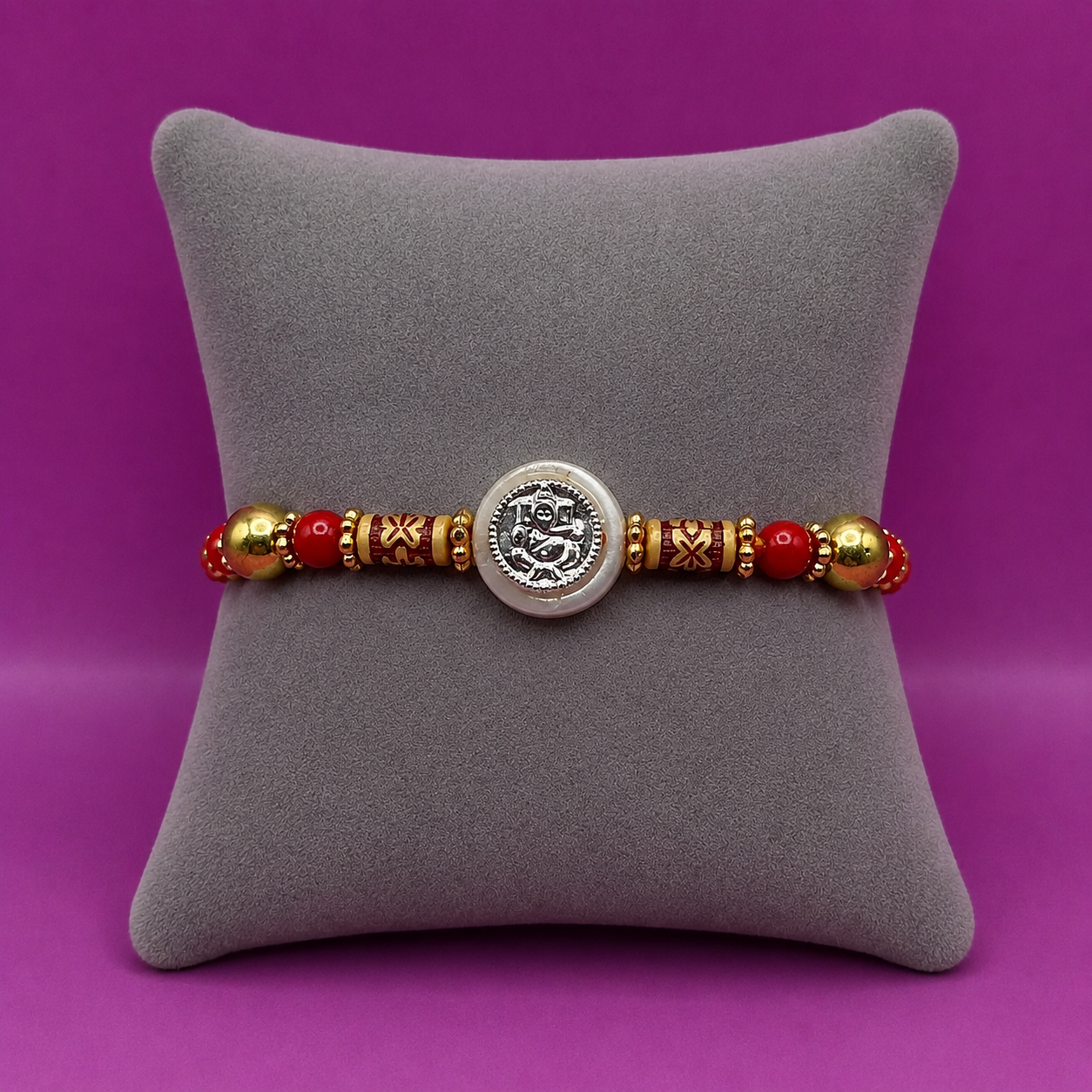 ChatGPT Image Jul 20, 2026, 11_13_21 AM Pure Silver Ganesh Rakhi with Beads Red & Yellow Thread
