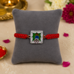 Silver Peacock Feather & Trishul Rakhi with Red Thread