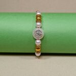 Ganesha with Silver Balls Rakhi – Symbol of Pure Love & Protection