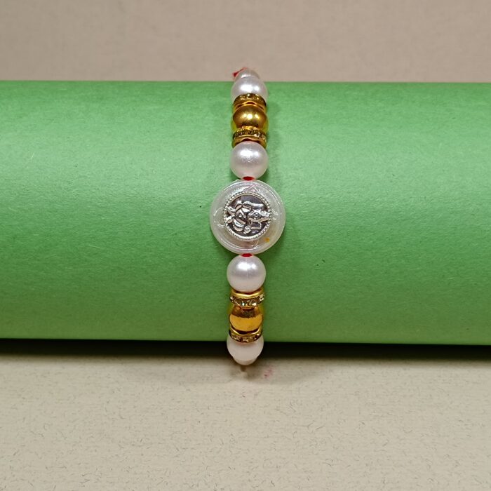 Ganesha with Silver Balls Rakhi – Symbol of Pure Love & Protection