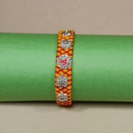 Om with 4 Flowers Silver Rakhi – Forever Tied in Purity & Love