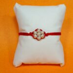 Divine Bond Silver Flower Rakhi – Crafted in Pure Silver