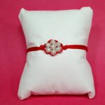 Divine Bond Silver Flower Rakhi – Crafted in Pure Silver