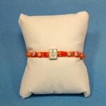 Ganesha with Six Peice Silver Rakhi – Symbol of Pure Love & Protection