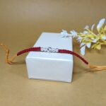 Simple & Elegant Pure Beads Rakhi with Red Thread