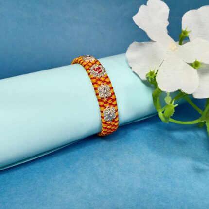 Om with 4 Flowers Silver Rakhi – Forever Tied in Purity & Love