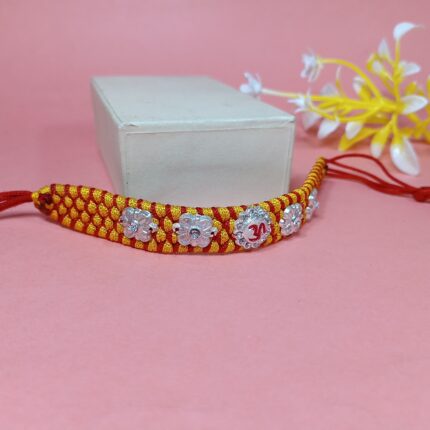 Om with 4 Flowers Silver Rakhi – Forever Tied in Purity & Love