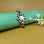 Elegant Pure Silver Om Rakhi With Kundan – Symbol of Bond & Blessings