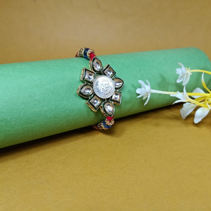 Elegant Pure Silver Om Rakhi With Kundan – Symbol of Bond & Blessings