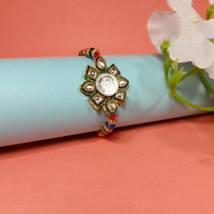 Elegant Pure Silver Om Rakhi With Kundan – Symbol of Bond & Blessings