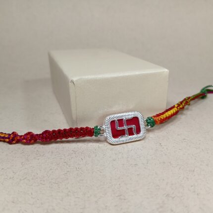 Elegant Pure Silver Swastik Rakhi with Red Enamel & Thread Work