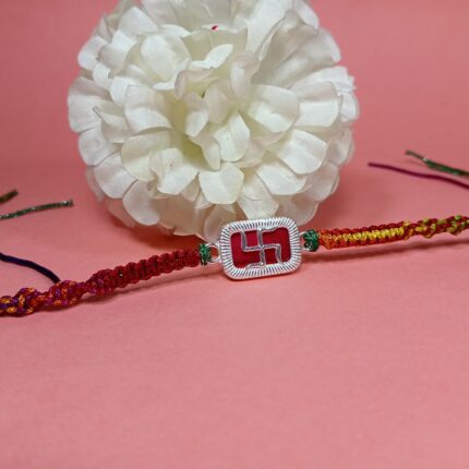Elegant Pure Silver Swastik Rakhi with Red Enamel & Thread Work