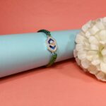 Pure Silver Ganesh Rakhi with Sacred Symbol & Traditional Thread