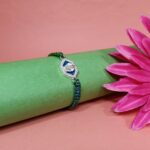 Pure Silver Ganesh Rakhi with Sacred Symbol & Traditional Thread