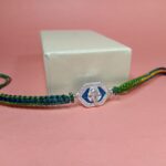 Pure Silver Ganesh Rakhi with Sacred Symbol & Traditional Thread
