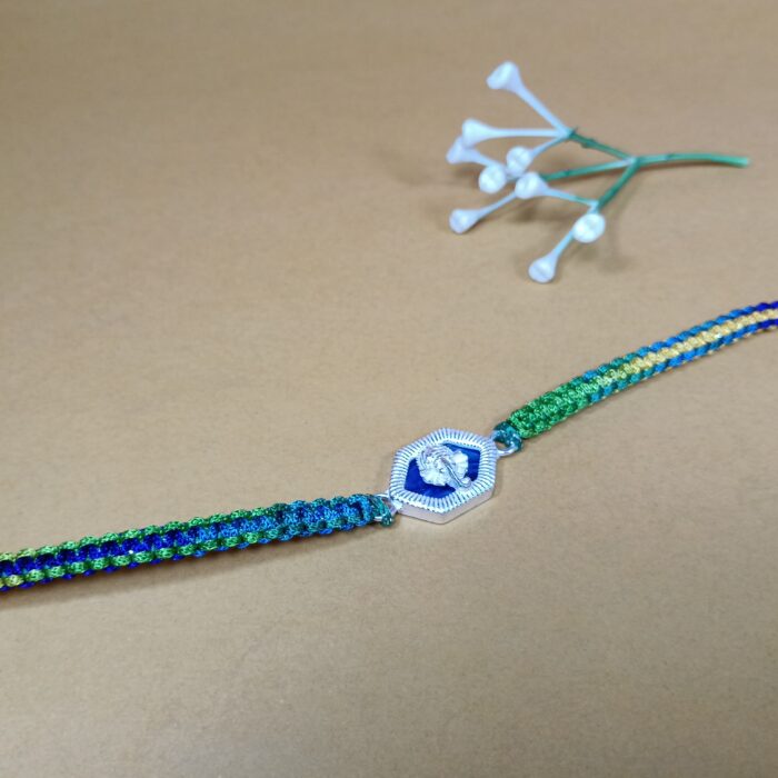 Pure Silver Ganesh Rakhi with Sacred Symbol & Traditional Thread