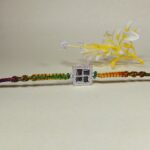 Pure Silver Swastik Rakhi with Multicolor Dhaga – Traditional Blessings in Style