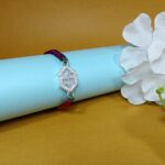 Pure Silver Hexagon Swastik Rakhi with Multicolor Dhaga – Strength, Style & Spirituality