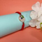 Pure Silver Peacock Rakhi with Colorful Morpankh – A Royal Thread of Love