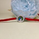 Pure Silver Krishna Rakhi with Colourful Mor Pankh Design
