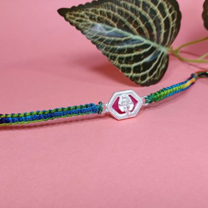 Silver Ganesha Rakhi with Green & Blue Thread