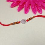 Pure Silver Ganesha Rakhi with Wooden Beads & Red Dhaga