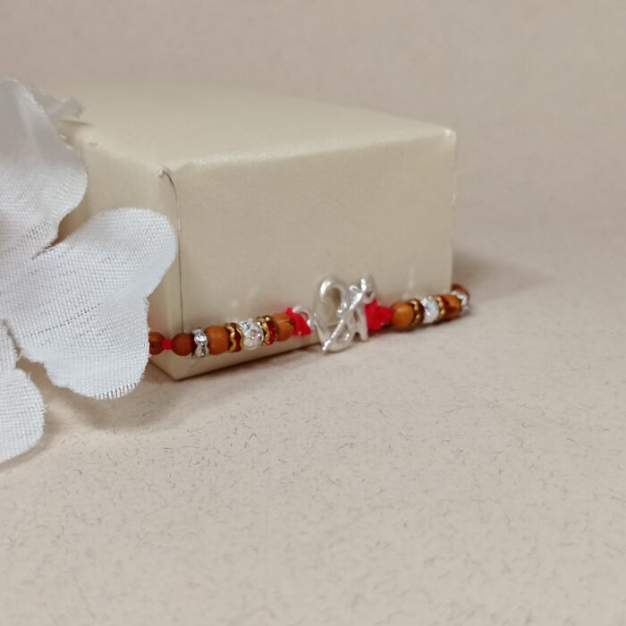 Pure Silver “Om” Rakhi with Beads & Red Thread